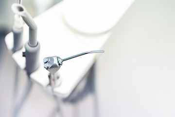 Dental instrument in stomatology clinic. Close up compressed nozzle air and saliva ejector. Professional dentist tools. Copy space © Kirill Gorlov