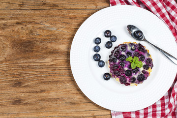 Blueberry tart, pie, tartlet with vanilla custard.
