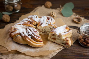 Brioche. Swirl Brioche with sugar powder. Estonian Kringle. Delicious Brioche with sugar and cinnamon/ Wreath. National pastries. Babka.