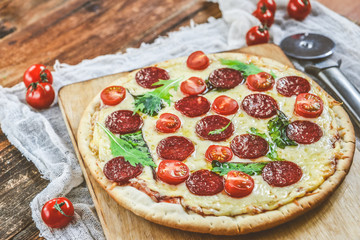 Tasty Pizza With Tomato Sauce, Pepperoni Sausage, And Mushrooms On Wooden Background Natural Rustic, A Pizza Cutter And Ingridienty.