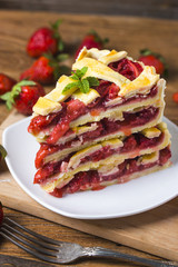 The strawberry pie in the wooden background