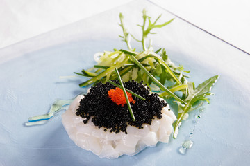 Red caviar, white caviar, fish and rucola