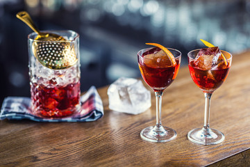Manhattan cocktail drink decorated on bar counter in pub or restaurant.