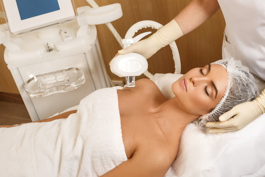 Beautiful woman in beauty salon during rejuvenation procedure
