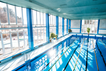 Fototapeta na wymiar An interior of an indoor public swimming pool.