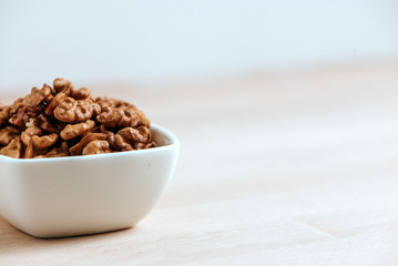Healthy lifestyle. Walnuts in a bowl. Copy space.