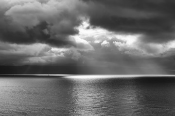 Seascape with Clouds and Beam of Light One Boat Black and White