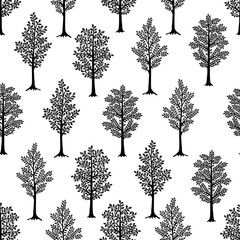 Obraz premium Seamless pattern. Black Trees isolated on white background. Ideal for textile print and wallpapers.