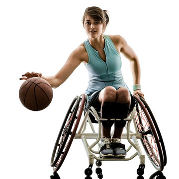 one caucasian young handicapped basket ball player woman in wheelchair sport  tudio in silhouette isolated on white background