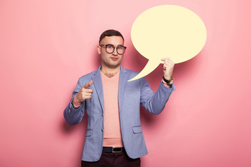 Handsome man in bright jacket with speech bubble
