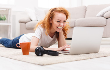 Happy student girl using laptop