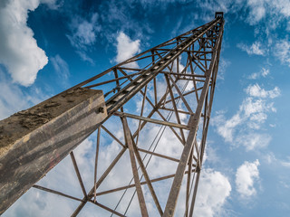 pile driver with clouds and blue sky