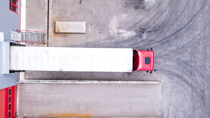 Aerial View of Loading Warehouse with Semi Truck. Aerial