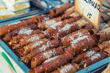 Sweet paste rolls on a street food festival.