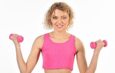 Sport. Fitness woman. Slim woman with dumbbells. Athletic girl flexing muscles with dumbbells. Fitness, sport, training, exercising and people concept - sporty woman exercising with pink dumbbells.