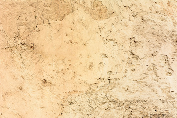 Brown-yellow texture with cracks, made on the shore of the black sea