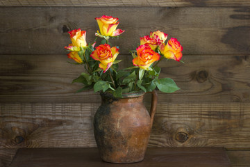 orange roses in a vase