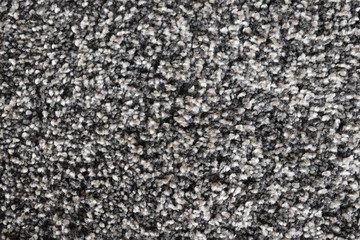 Closeup of a woven background in brown and white - looks like a carpet