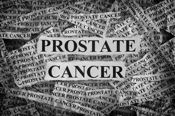 Torn pieces of paper with words Prostate Cancer