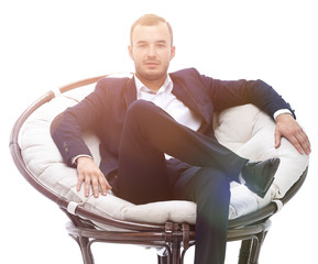 Fototapeta premium young businessman sitting in a comfortable chair