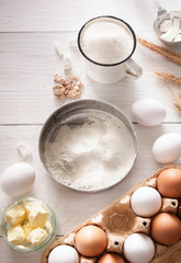 Baking ingredients on rustic white background