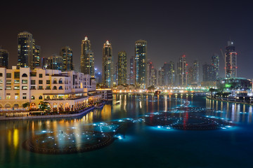 Naklejka premium Skyscrapers of Dubai Downtown at nignt