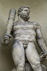 Statue of Hercules with a three headed dog at entrance of the Ducal Palace in Modena.
