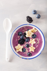 healthy berry smoothie bowl with banana and sesame seed