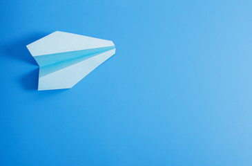 paper plane on blue color background