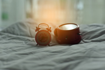 Fototapeta na wymiar Colorful alarm clock in the morning