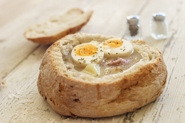 Traditional polish soup called Zurek served in small bread