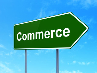 Finance concept: Commerce on green road highway sign, clear blue sky background, 3D rendering