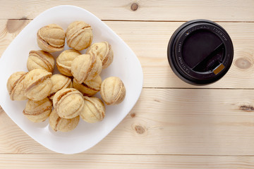 Walnuts cookies with boiled condenced milk with coffee top view copy space