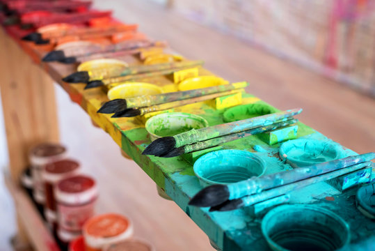 Watercolor painting brushes on an art room