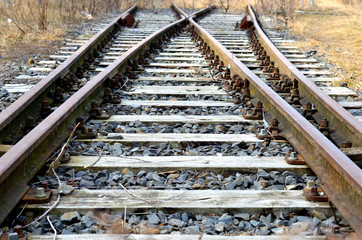 Fototapeta premium Weiche Bahngleis Gleis Schiene mit Bohlen und Schwellen