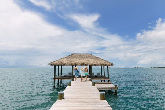Women Walking on Pier in Belize