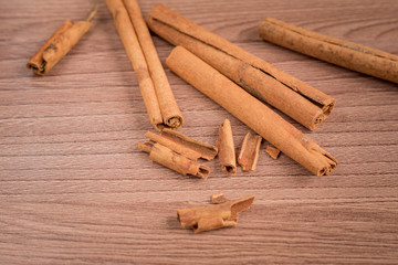 cinnamon sticks on wooden table.