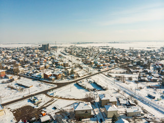 Aerial view of the bulgarian  village at sunny winter day.