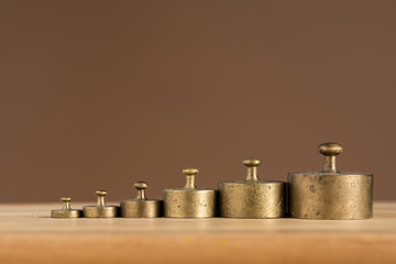 Old brass weights for a kitchen scale