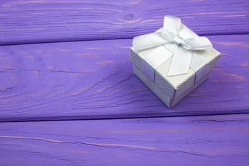 Gift box on the wooden background