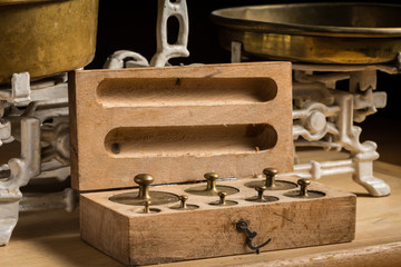 Old brass weights for a kitchen scale