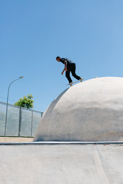 Man riding down in skatepark