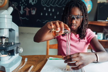 Close up of an girl doing a chemistry experiment