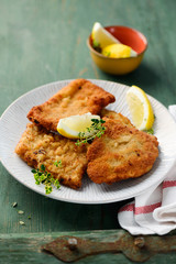 Breaded original schnitzel, with lemons