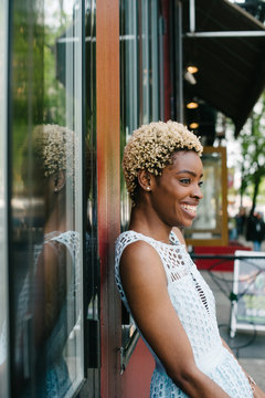 Portrait of happy young woman in the city