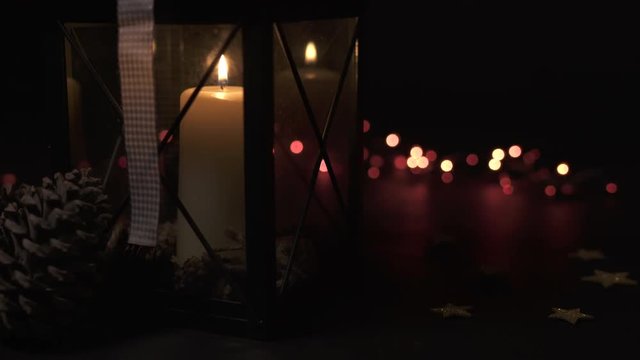 Candle burning in a lamp