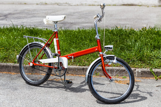 Vintage classic 70s red folding bicycle bike in perfect condition