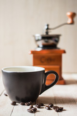 Black coffee in a glass on a wooden table