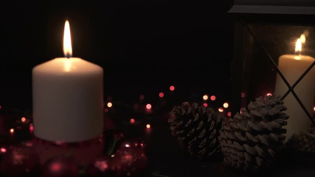 Christmas decorations with candles and pine cones