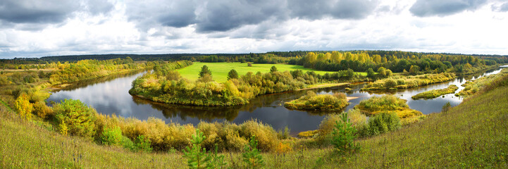 Fototapeta na wymiar Panorama of a beautiful autumn rural landscape with a river
